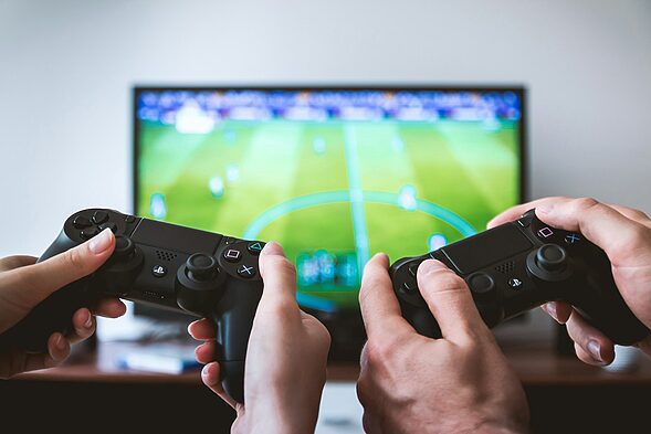 two people playing Sony PS4 game console, Unveiling the Risks of the Indoor Lifestyle - The Rise of Sedentary Lifestyles and Mental Health Consequences of Indoor Generation