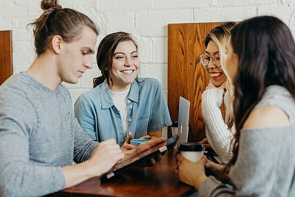 A group of friends at a coffee shop, office love