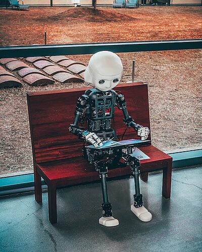 black and white robot toy on red wooden table, AI Innovations